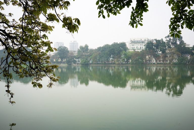 Reflections of Hanoi at Hoan Kiem Lake.